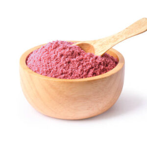 Bio fruit protein pink powder in wooden bowl isolated on white background.